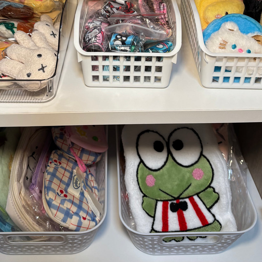 Close up of store product including hand towels and pencil pouches. 