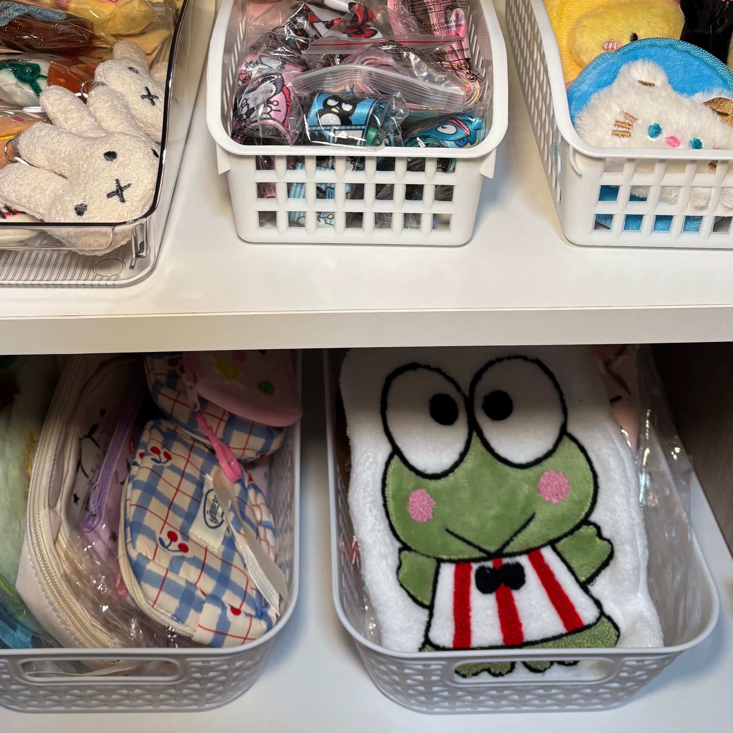 Close up of store product including hand towels and pencil pouches. 