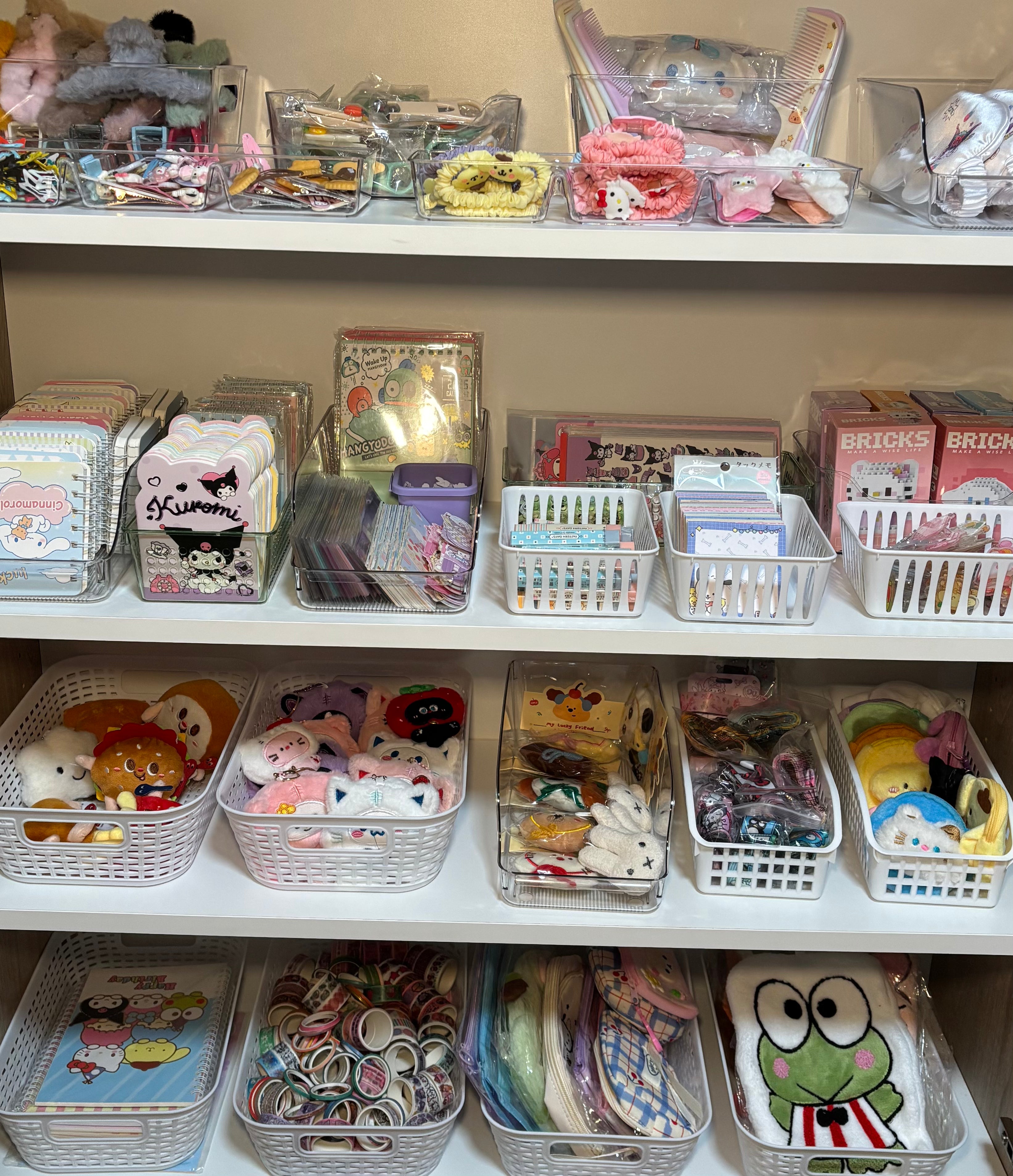 Shelves with various small items including hair accessories and stationery in a store setting.